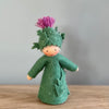 A felt Burdock Flower Fairy wearing a green dress and a pink flower in the hat with light/medium skin tone | © Conscious Craft